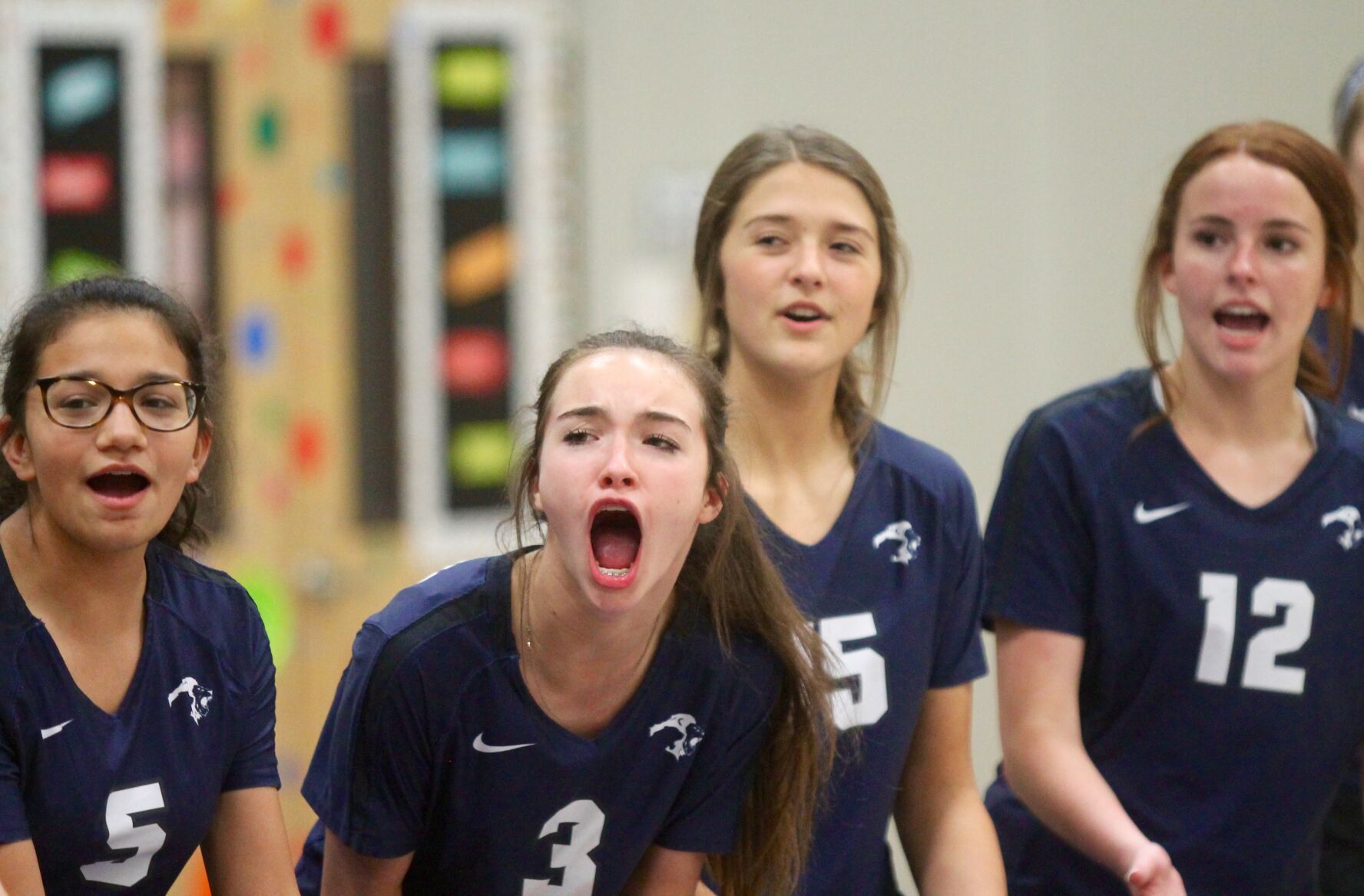 Shyann Maddox, center, and her teammates